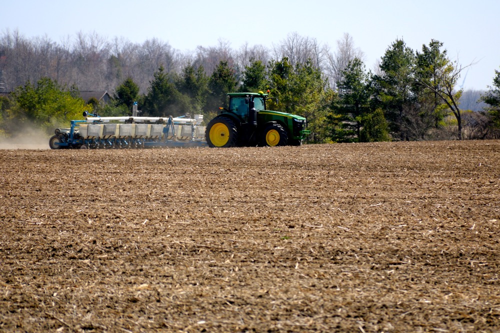 Corn planting has only just started in Ontario due to recent cool and wet weather. Some have started, however, including this farmer between Parkhill and Grand Bend. 