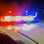 Red and blue Lights of police car in night time. Night patrolling the city. Abstract blurry image.