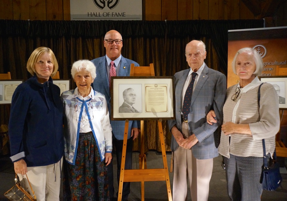 Inductee Gordon Clifford Leitch's family (from left) Jean Vander Ploeg (grand daughter of Gordon Leitch), Ann Abraham (daughter of Gordon Leitch), Jack Leitch (son of Gordon Leitch), Mary Bain (grand daughter of Gordon Leitch). Back row – Robert Flack, President & CEO, Masterfeeds Inc. (nominator of Gordon Leitch to OAHF).