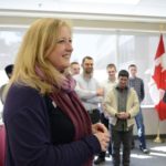 Transport Minister Lisa Raitt, shown here last month at Carleton University, says she doesn’t yet plan to mandate minimum grain traffic levels in specific rail corridors. (TC,gc.ca)