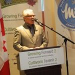 Agriculture Minister Gerry Ritz, shown here in February in Brampton, Ont., said farmers and processors would be “compensated” for losses incurred through any increased market access granted under a TPP deal. (Agr.gc.ca)
