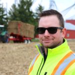 Dave Park, Sarnia-area farmer and president of the Cellulosic Sugar Producers Co-operative stands in front of one of the bale accumulators that will be used by the co-op. Photo: John Greig