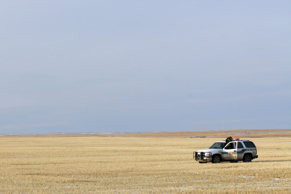 A U.S. Customs and Border Protection agent monitors the Canada/U.S. border near Sweet Grass, Montana, about 100 km southeast of Lethbridge. (CBP.gov)
