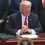 U.S. President Donald Trump signs an executive order April 29 in Pennsylvania on the establishment of the Office of Trade and Manufacturing Policy. (Screengrab from video at Whitehouse.gov)