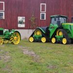 100 years of tractors. The Waterloo Boy was the first tractor sold by John Deere, shown next to a new 9520RX.