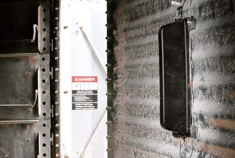 The GrainViz imaging sensors (the black device) magnetically attach to the inside bin wall. A 24-sensor array provides 3D imaging, revealing the moisture content of every bushel in the bin. 