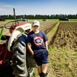 Luke Wardell with his antique tractor at the plowing match.