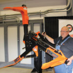 Inventor Darcy Goossen explains the operation of his Tire Grabber attachment for skid steer and tractor loaders, during Canada’s Farm Progress Show. It can lift, rotate and position large tractor and sprayer tires during removal or installation.