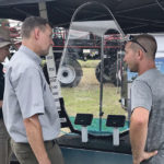 Tom Wolf gets a look at the Simon Innovations Accu-Volume system.