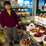 Heidi Behan, a second-generation owner at Moore Orchards in Hamilton Township, is seen here at her farmstand.