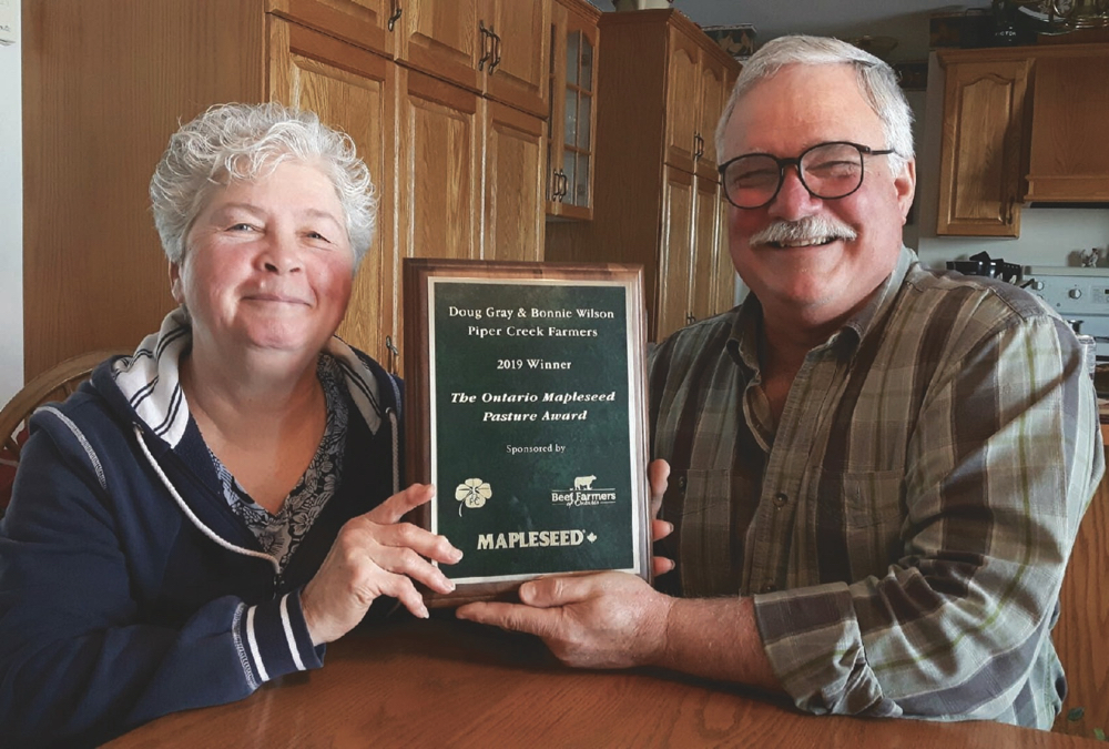 Bonnie Wilson and Doug Gray display the Mapleseed Pasture Award they recently won at the Beef Farmers of Ontario annual meeting.