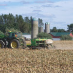 Getting out of the tractor cab to check soil conditions is important to getting
the crop off to a strong start.