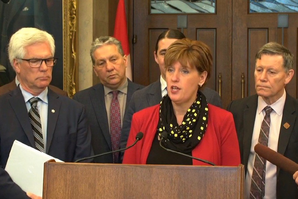 Agriculture Minister Marie-Claude Bibeau announces expansion of the federal Advance Payments Program in Ottawa on May 1, 2019, flanked by Trade Diversification Minister Jim Carr (l) and his fellow Winnipeg MPs Dan Vandal, Robert Falcon-Ouellette and Terry Duguid. (Video screengrab from Agriculture and Agri-Food Canada via Facebook Live)
