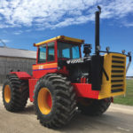 A Versatile 835 tractor parked on a farm