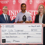 University of Guelph’s Malcolm Campbell, left, who is vice-president of research, and Sherri Cox, right, executive director of research innovation and knowledge mobilization, flank pitch competition winner Sujeevan Ratnasingham, founder of LifeScanner.
