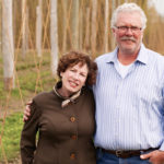 Laurie Thatcher-Craig and John Craig in their hops yard.