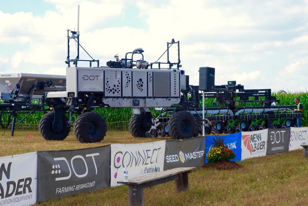 The U-shaped Dot A-U1 “loads” a SeedMaster row-crop planter on to its platform during the demonstration at Canada’s Outdoor Farm Show. (Ralph Pearce photo)
