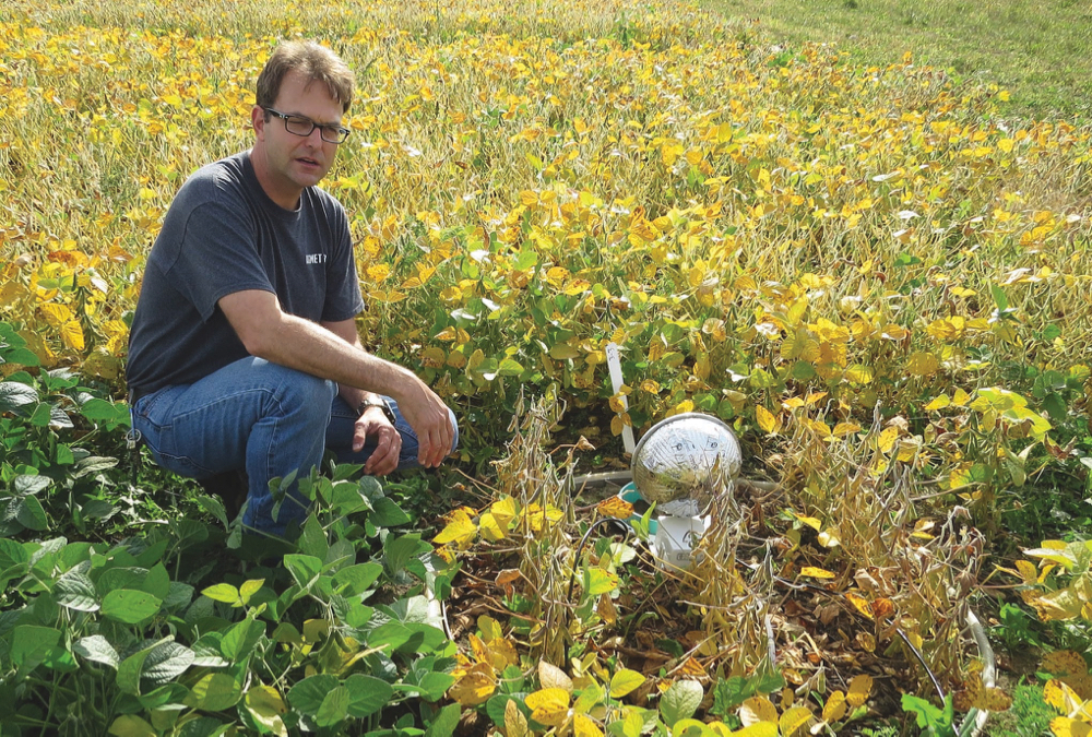 Sean Jordan of University of Guelph Environmental Sciences, pictured with lysimeter. 