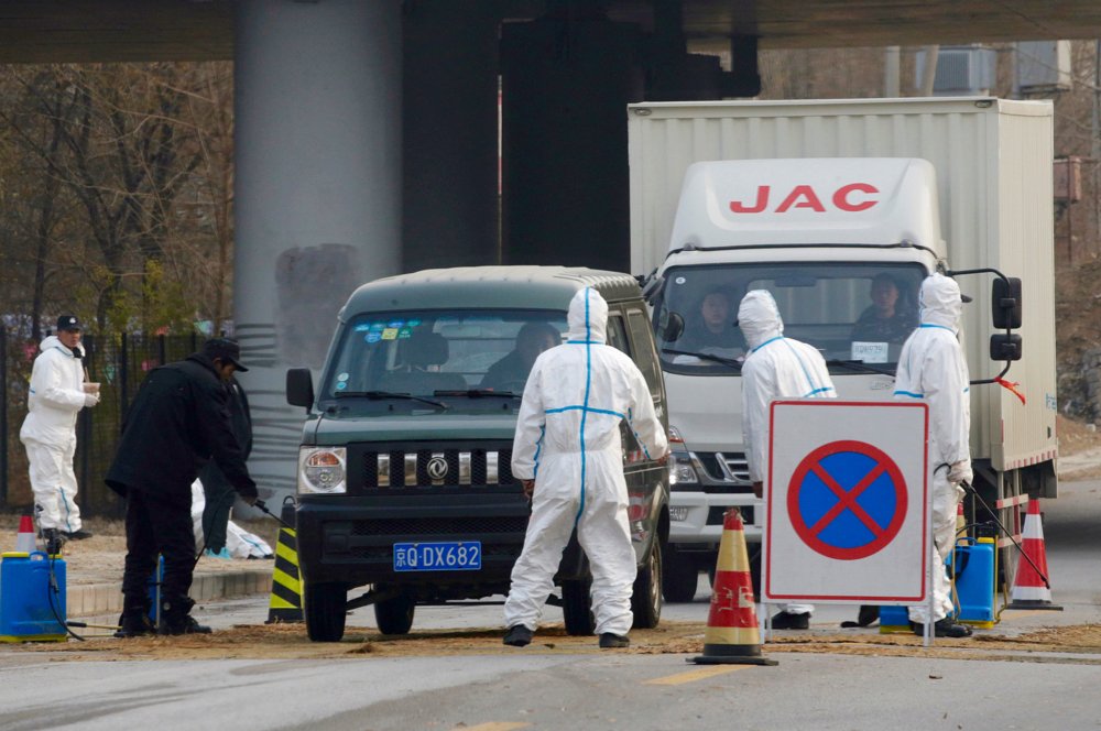 Workers in protective suits at a checkpoint near a farm where African swine fever was detected, in Fangshan district of Beijing, China Nov. 23, 2018. The disease has spread rapidly to several countries in Southeast Asia with more countries likely to be hit in the coming months.
 Photo: Reuters/File
