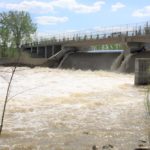 Spring runoff flows through a control structure on the Assiniboine River near Portage la Prairie, Man. in 2014. (MarketsFarm photo by Glen Hallick)