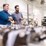 Michael Taschuk, chief technology officer and founder of G2V, with Ryan Tucker, chief executive officer, talk at the G2V production facility.