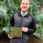 Dylan Sher with his Farm & Food Care Champion award.