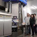 Marc Comtois, Kathleen Comtois, France Lemieux, Julie Comtois, Julien Turmel, and Steve Comtois in their new automated milking barn.