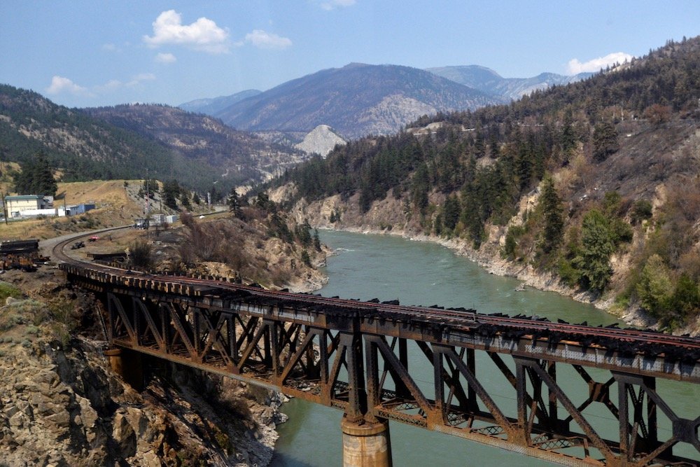 Charred remnants of a rail bridge destroyed by a wildfire on June 30 are seen during a media tour by authorities in Lytton, B.C. on July 9, 2021. (Photo: Reuters/Jennifer Gauthier)
