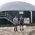 Gord Green, right, and his son Dave of Greenholm Farms near Embro stand in front of the farm’s biodigester, which uses both on-farm and off-farm sources of organic waste.