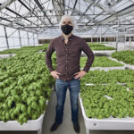Iron Ox CEO Brandon Alexander poses for a portrait in the company’s greenhouse in Gilroy, California.