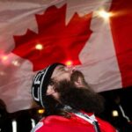 A man reacts as protestors block access to the Ambassador Bridge at Windsor, Ont. on Feb. 11, 2022.