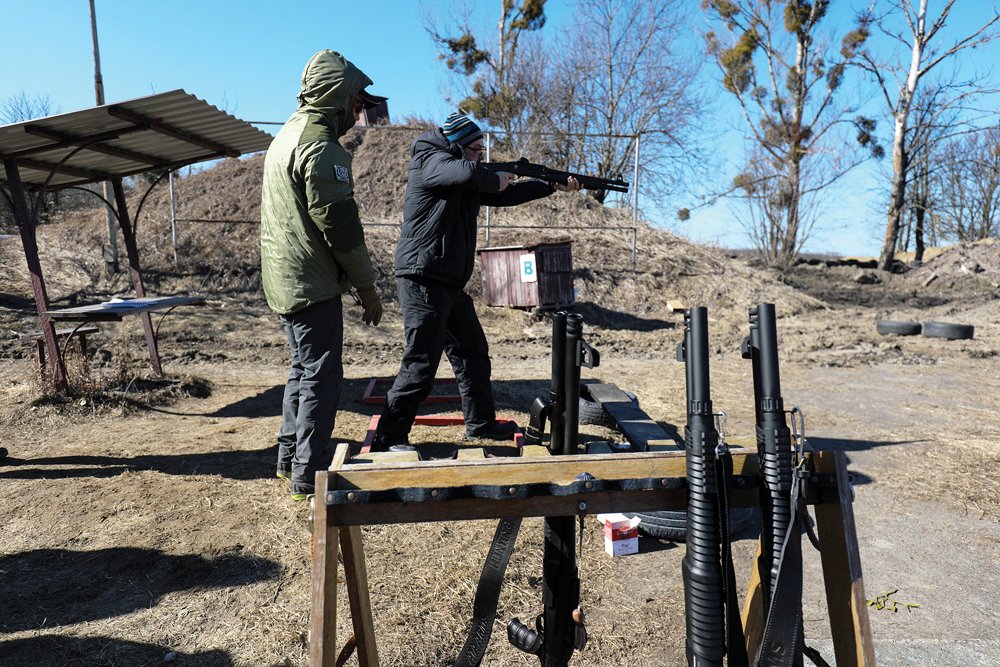 Civilians who bought their own weapons take part in shooting exercises before joining the territorial defence and patrolling Lviv, as Russia’s invasion of Ukraine continues.