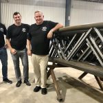 Calhoun founder Leonard Calhoun, far right, with sons Jeremy, centre and Sean, left, celebrate the Goderich Super Structure facility expansion as Calhoun’s rolls into their 30th year in production.