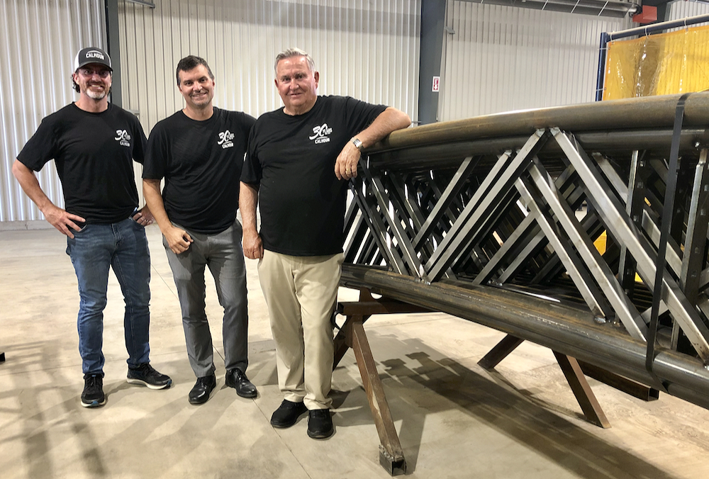 Calhoun founder Leonard Calhoun, far right, with sons Jeremy, centre and Sean, left, celebrate the Goderich Super Structure facility expansion as Calhoun’s rolls into their 30th year in production.