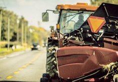 It’s important to have a Slow Moving Vehicle sign clearly visible on the back of the tractor or implement and to use hazard lights (four-way flashers).