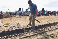 OMAFRA engineer Alex Barrie examines the damage done to the soil and to his pressure sensor by a fully-loaded gravity wagon during a Compaction Day event hosted on Aug. 5 by the Perth County chapter of the Ontario Soil and Crop Improvement Association.