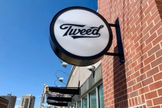 Signage outside a Tweed cannabis store in Winnipeg’s Osborne Village, roughly 60 metres west of the high-density neighbourhood’s Tokyo Smoke store. (Dave Bedard photo)