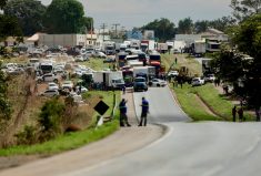 Supporters of Brazil&#8217;s President Jair Bolsonaro block highway BR-060, during a protest against President-elect Luiz Inacio Lula da Silva who won a third term following the presidential election run-off, in Abadiania, Brazil, October 31, 2022.  Photo: Reuters/Ueslei Marcelino
