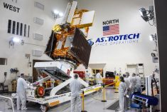 The SWOT spacecraft is moved into a transport container inside the Astrotech facility at Vandenberg Space Force Base on Nov. 18, 2022. (Photo: USSF 30th Space Wing/Chris Okula)