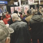 Farmers gather to talk to exhibitors at the 2019 Chatham-Kent Farm Show.