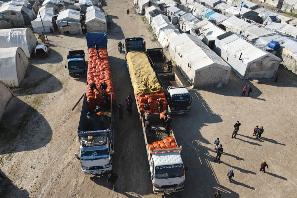 Humanitarian aid provided by Palestinian Arabs is distributed at northwestern Syria’s Deir Ballut and Muhammadiyah camps near the Turkish border on Feb. 13, 2022. (Photo: Rami Alsayed/NurPhoto via Reuters)
