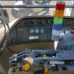 The RcFarmArm allows an operator to manipulate tractor controls from outside of the cab with a remote controller.