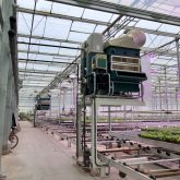 A liquid desiccant dehumidifier installed inside a greenhouse.