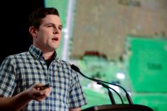 Tom Aikins explains how his operation works during the Beef Farmers of Ontario annual dinner Feb. 22 in Toronto.