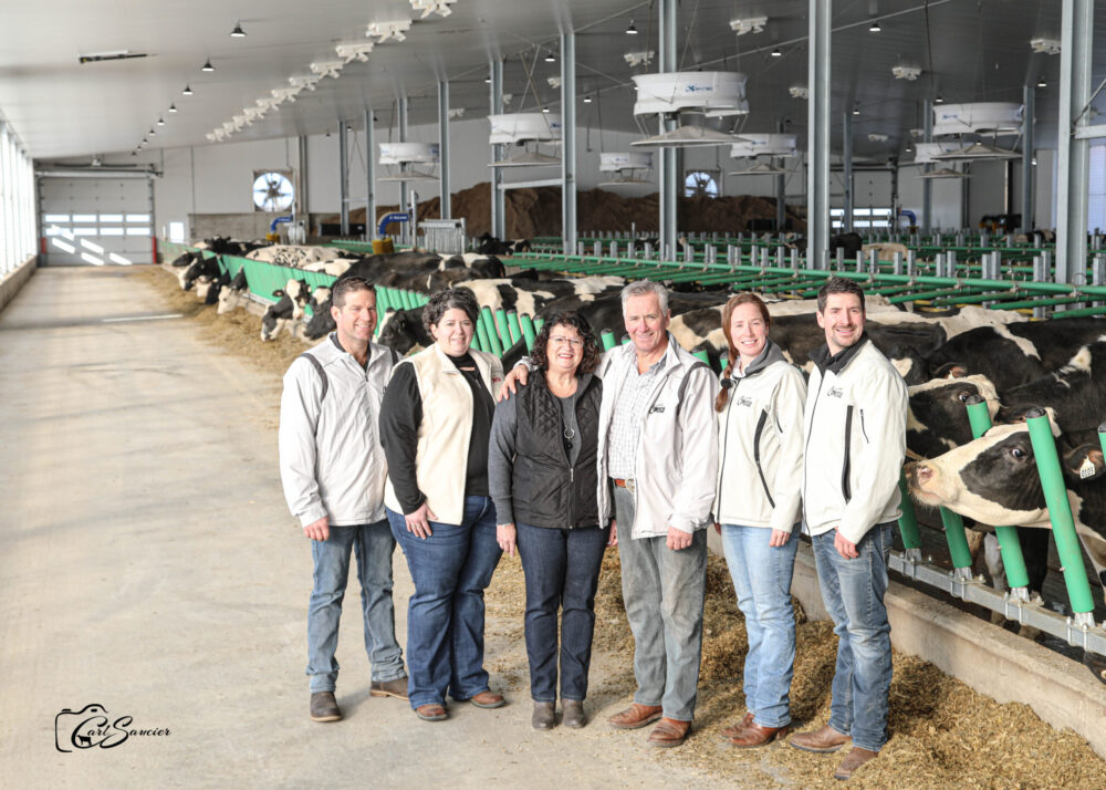 The co-owners of Ferme Comestar Holstein: Julien Turmel, Julie Comtois, France Lemieux, Marc Comtois, Kathleen Comtois and Steve Comtois.