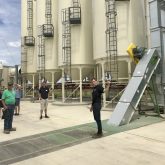 David Felder, director of business development for Petrolia-based Field Farms Marketing, conducts a tour of the company’s new crop cleaning and conditioning facility during an open house on June 22.