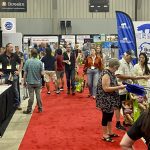 Congress attendees stroll past some of the 128 exhibitors June 21.