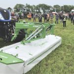 Following an earlier-than-planned indoor lunch on July 6 near Paisley, 2023 Forage Expo attendees stepped into a brief period of very light rain to watch demos of hay-cutting — including by this three-sectioned, front-and-rear mounted disc mower from Polish manufacturer Samasz.
