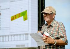 Ken Mitchell, an Annan area crop and beef farmer, shares some of the insights SWAT mapping, seen in the distance, provided in addressing uneven growing conditions in his corn and alfalfa fields during the Grey County Soil and Crop Improvement Association July crop tour.
