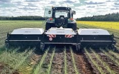 The three 10-foot covers prevent ambient sunlight from entering the spraying chamber. The Ecorobotix uses its own light source so the algorithms always know what their light waves signify.